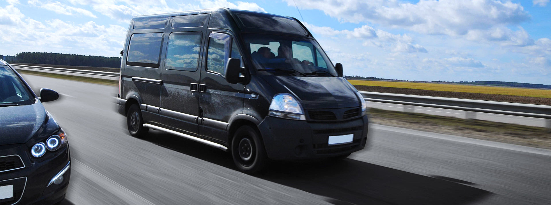 black van on the highway